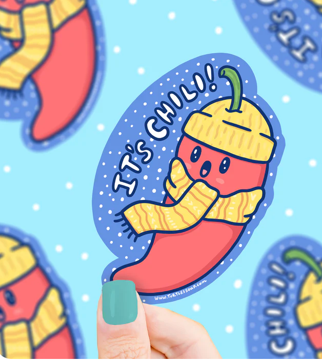 It's Chili Hot Pepper Sticker featuring a cute chili wearing a yellow hat and scarf, weatherproof and scratch resistant.