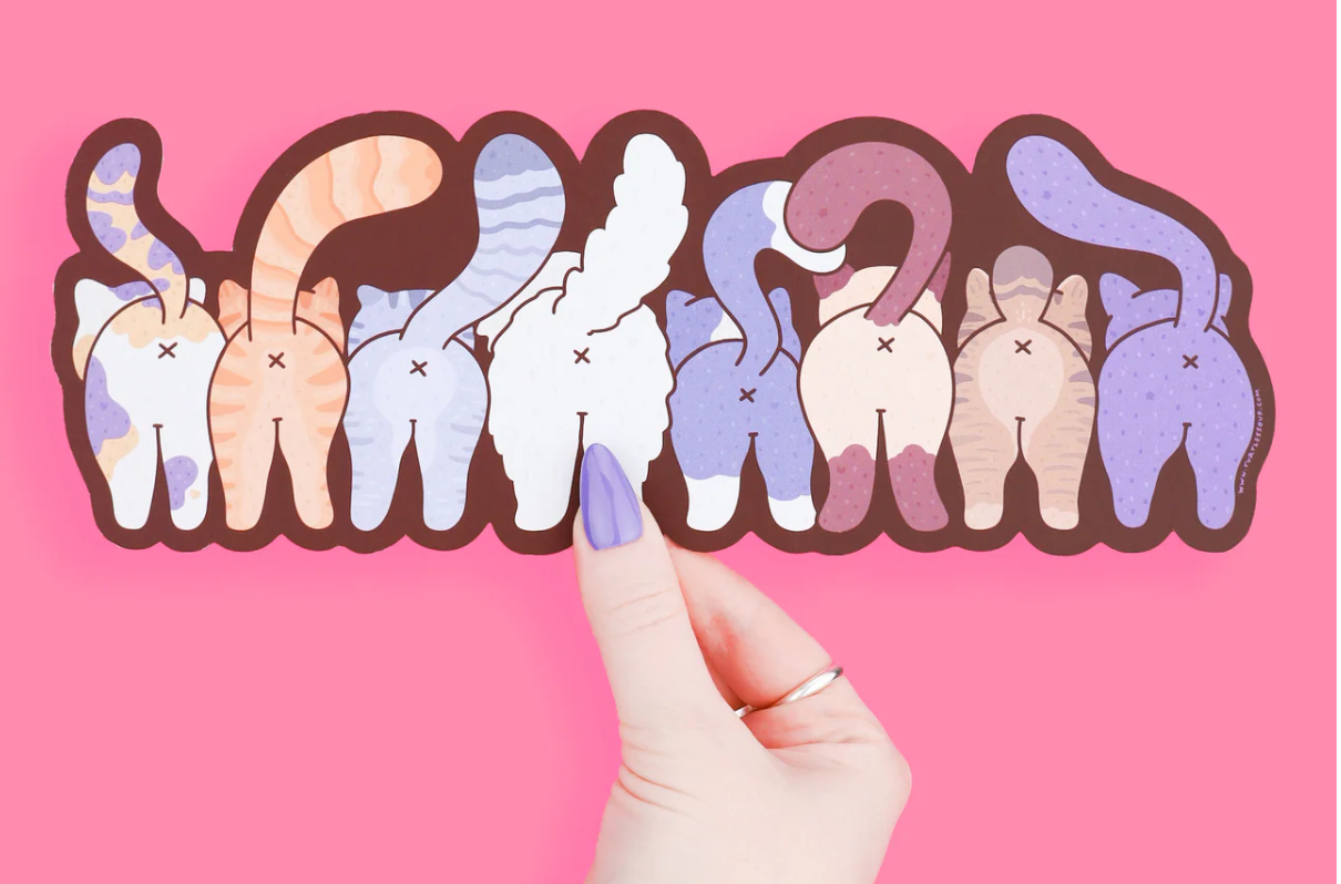 Funny Cats Bookmark showing the adorable backsides of eight colorful cartoon cats with tails raised on a pink background.