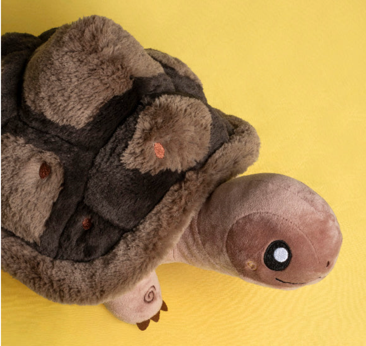 Soft plush tortoise toy with friendly face and detailed shell, called Tortoise Mini, perfect for all ages.