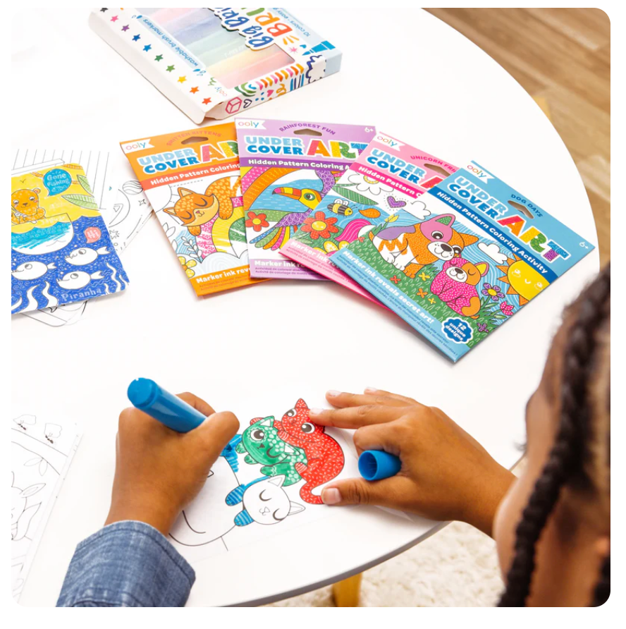 Child coloring dog illustrations in Undercover Art | Dog Days hidden pattern activity set.