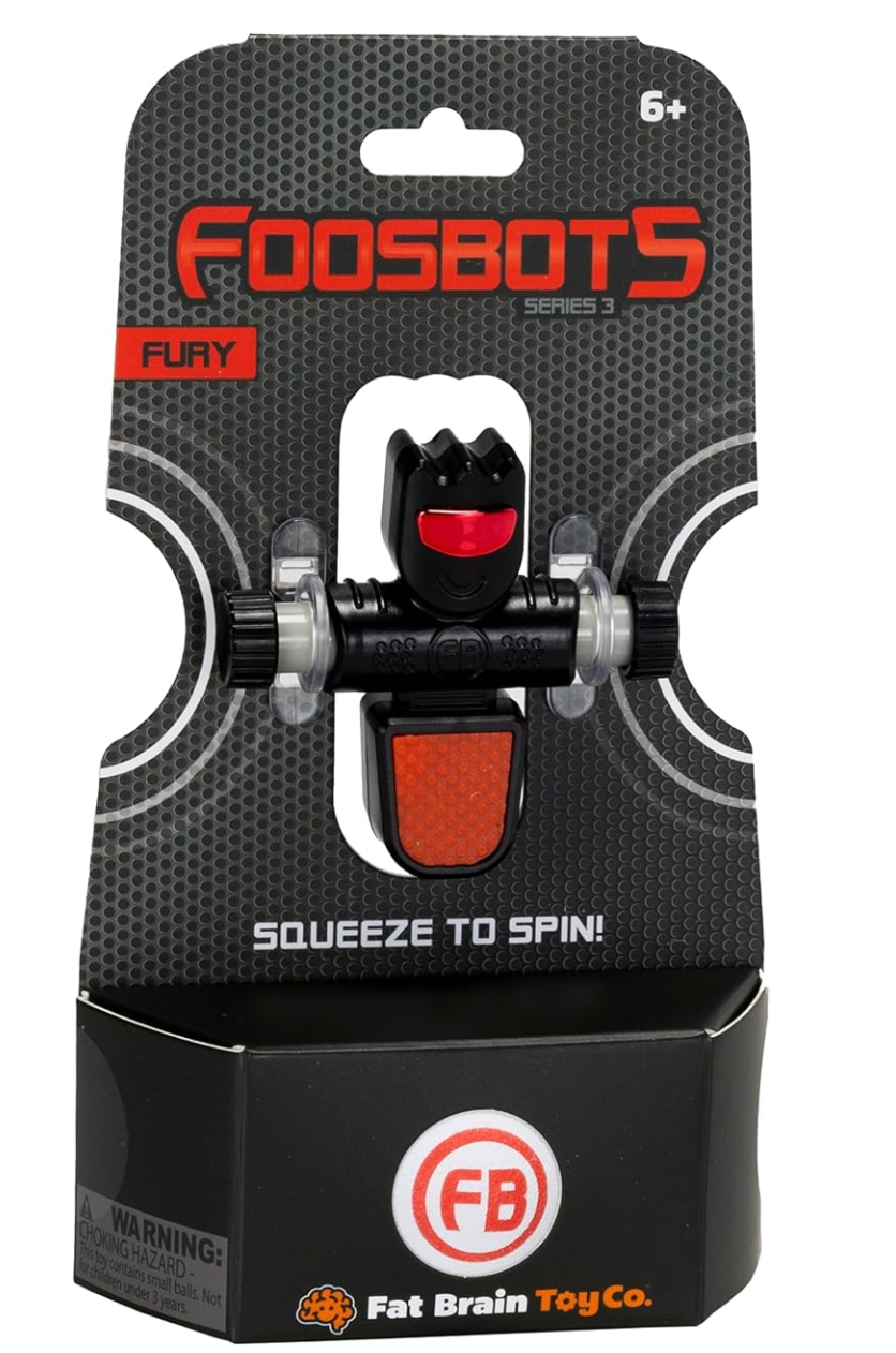 Foosbots Single toy figure in black and red packaging, designed to squeeze and spin for fast ball kicks.
