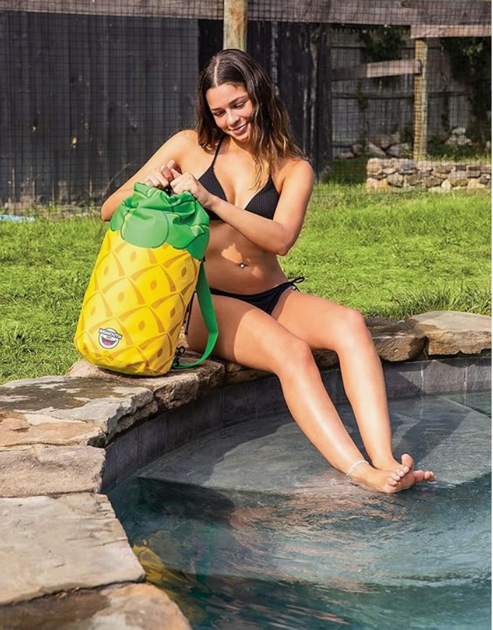 Woman in black bikini sitting by pool with Dry Bag | Pineapple waterproof backpack beach bag