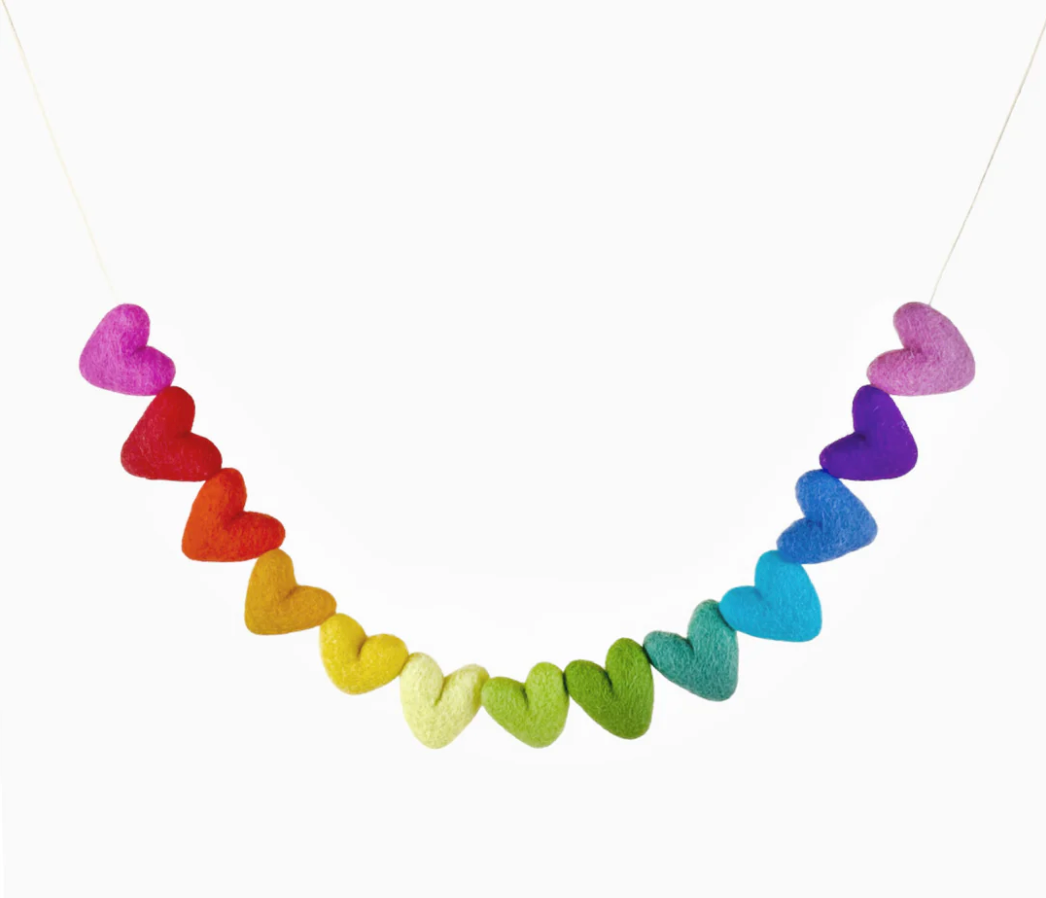 Felt Garland | Rainbow Hearts features 13 colorful felt hearts handmade from New Zealand wool on white cotton string.
