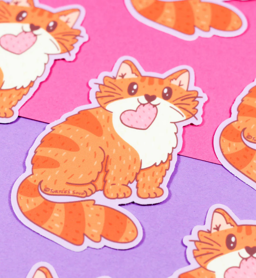 Orange Cat with Heart Sticker featuring a cute tabby cat holding a pink heart on colorful backgrounds.