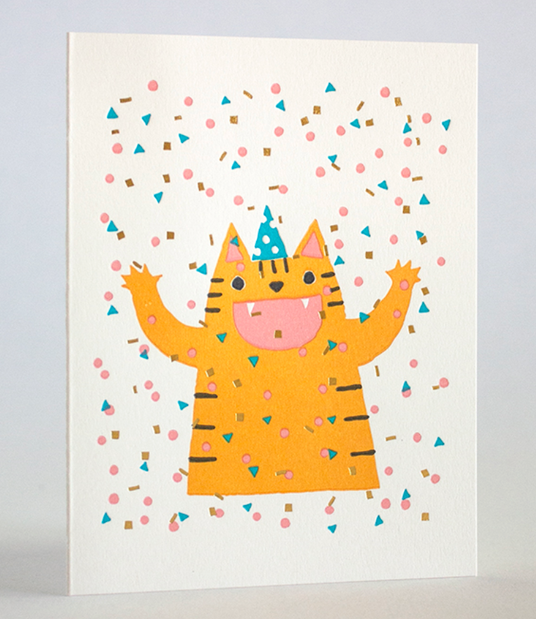 Confetti Cat Card featuring a cheerful orange cat with party hat and colorful confetti, letterpress on recycled paper.