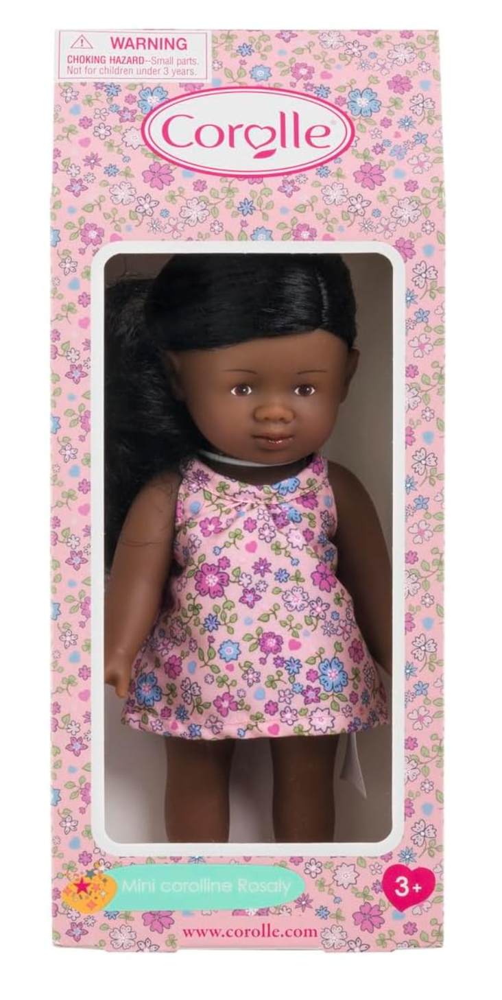 Mini Corolline Rosaly doll with dark hair in floral dress, 8-inch petite vinyl doll for ages 3 and up.