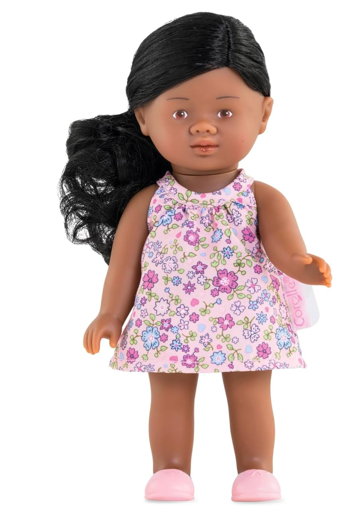 Mini Corolline Rosaly doll with dark curly hair, floral dress, and pink molded shoes, 8-inch petite collectible toy.