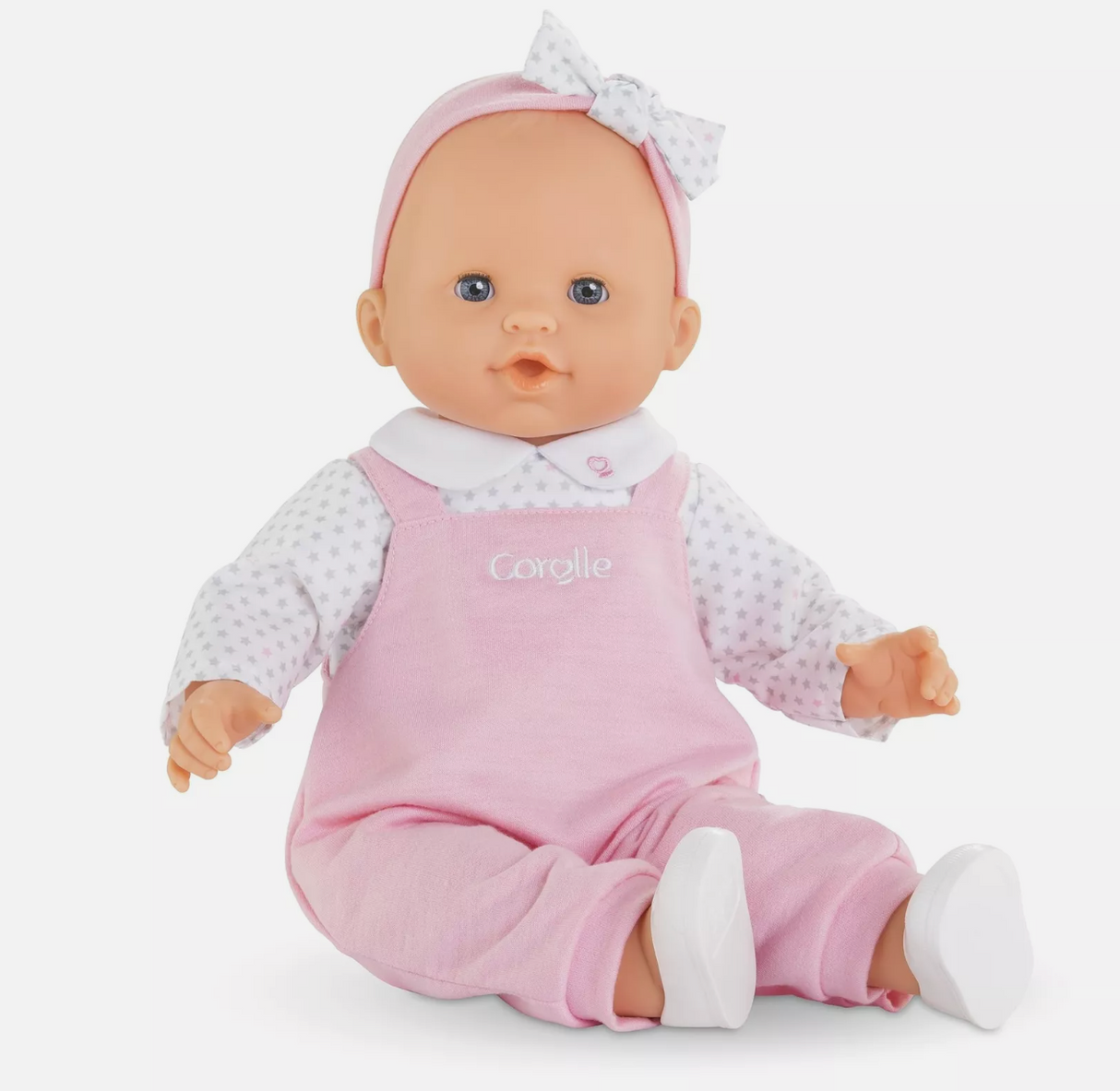Grand Poupon Lise doll with soft vinyl skin, blue eyes, pink overalls, and matching headband for ages 2 and up.