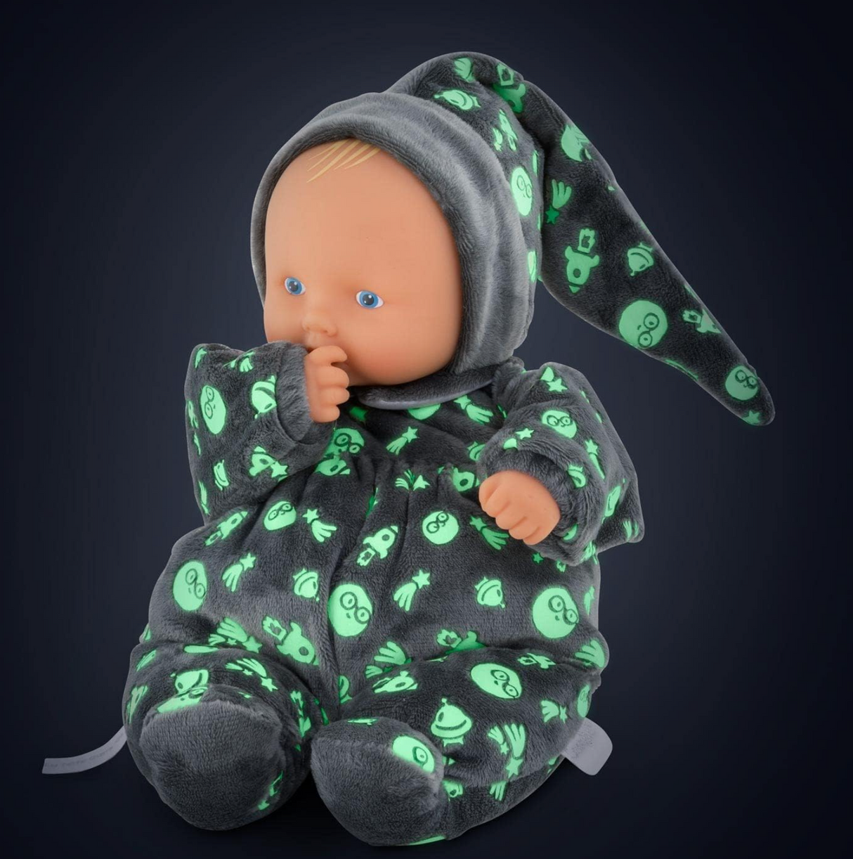 Babipouce Glow in the Dark doll in cozy outer space pajamas glowing softly with a realistic vinyl face.