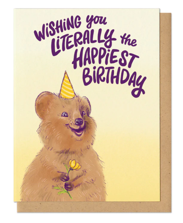 Literally Happiest Birthday Quokka Card featuring a smiling quokka with a party hat holding a flower on recycled paper.