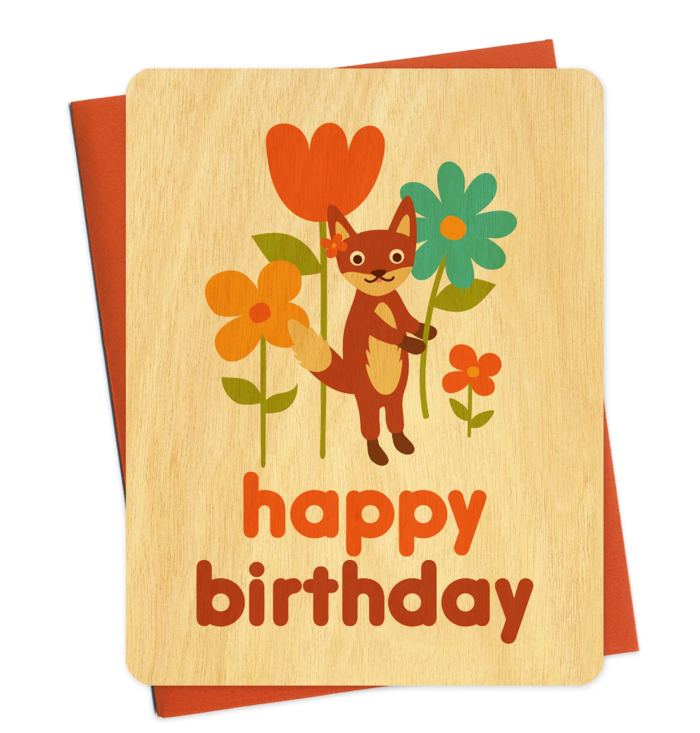 Fox Flowers Wood Birthday Card featuring a cute fox holding colorful flowers on sustainable birch wood.