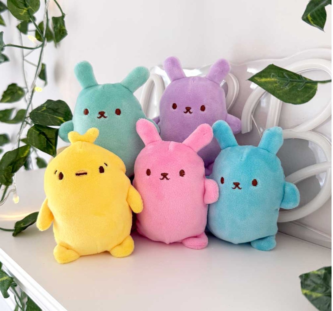 Bubble Stuffed Squishy Friend Easter Bunny Edition plush fidget toys in assorted colors displayed on a shelf.