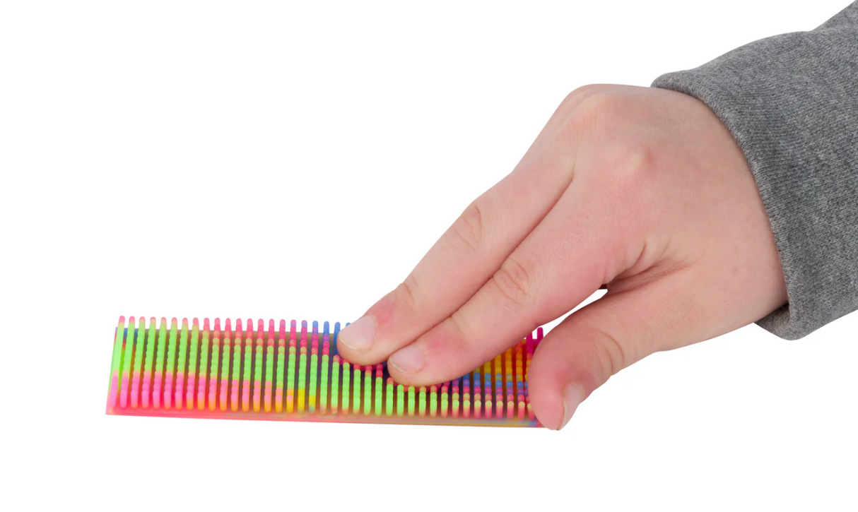 Hand pressing colorful textured Zen Strips | Multicolor Silicone 2pk for sensory calming and focus.