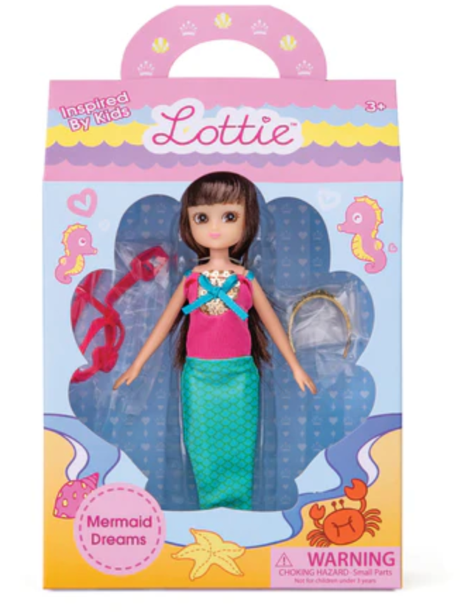 Lottie Mermaid Dreams doll with bendable knees, mermaid tail, pink top, crown, and accessories in colorful packaging.