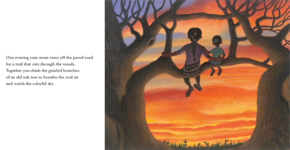 Home shows two children sitting on oak tree branches, watching a vibrant sunset sky over a peaceful natural scene.