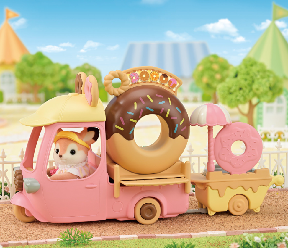 Dip Dip Donuts Wagon toy featuring a pink donut delivery truck with big chocolate donut and cute animal driver figure.