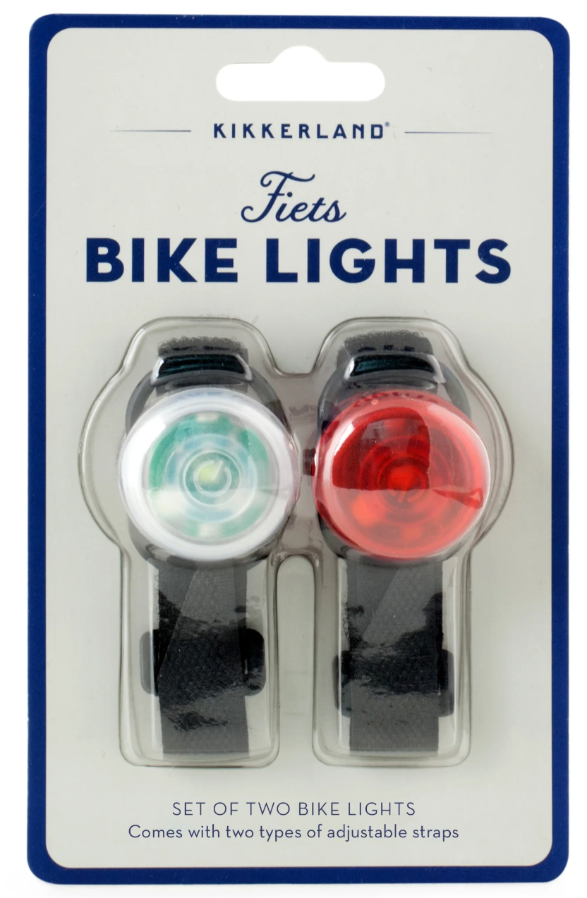 Fiets Bike Lights set with one white and one red LED light, featuring adjustable straps for versatile use.