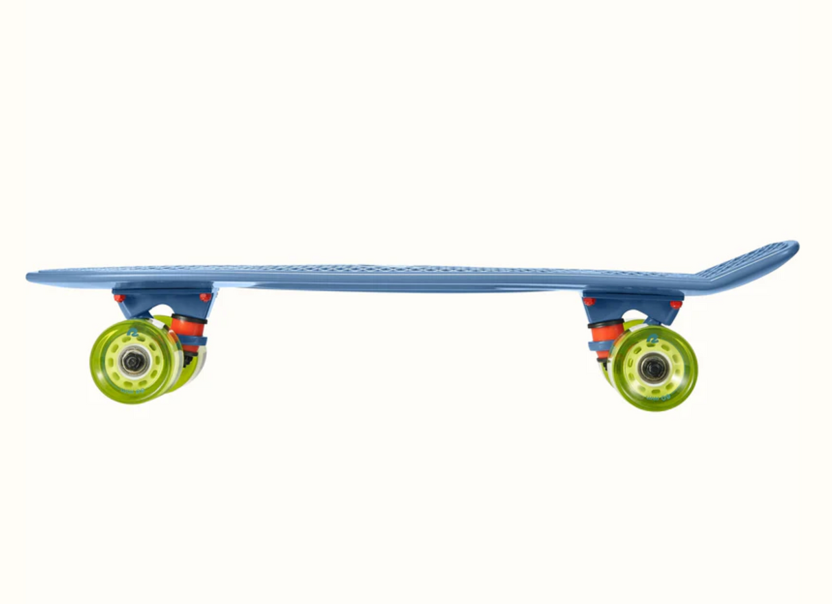 Quip Mini Cruiser Skateboard Marine Blue side view showing durable plastic deck and bright green wheels ready to roll.