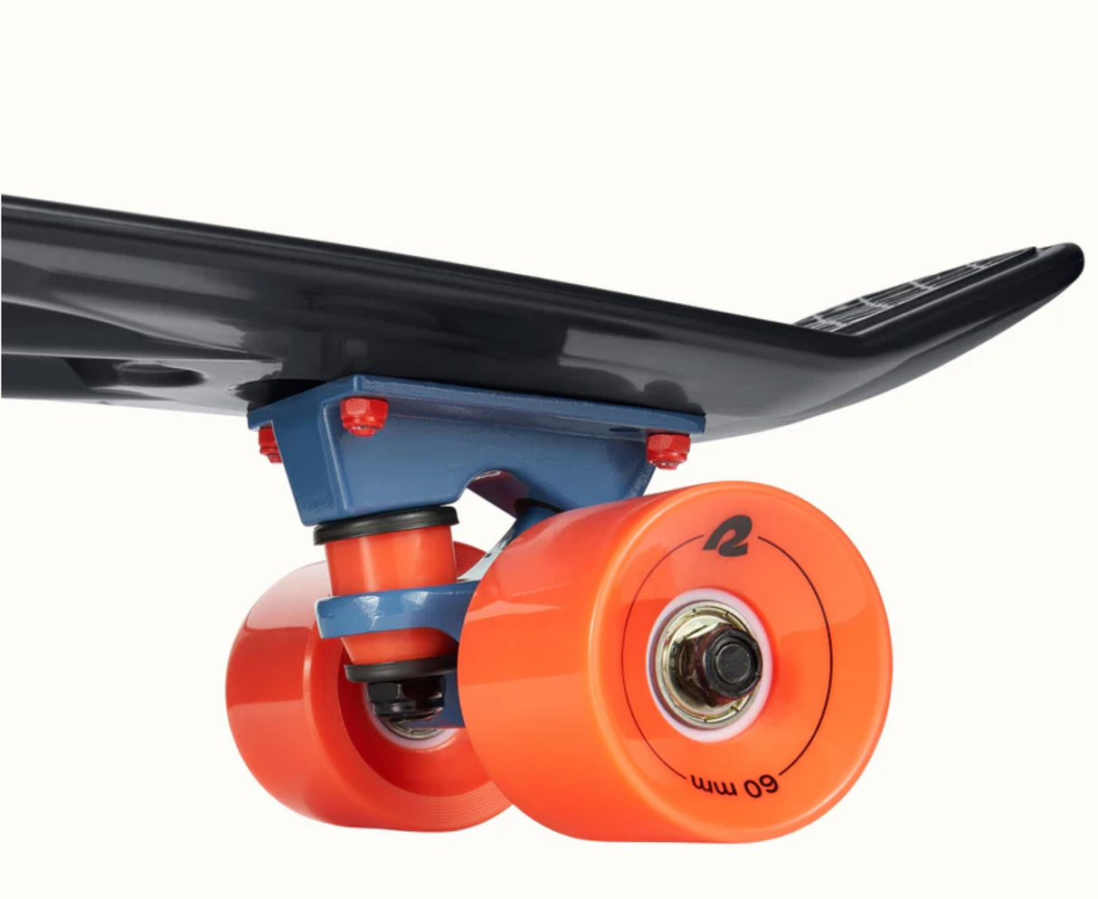 Quip Mini Cruiser Skateboard | El Diablo close-up of orange wheels and black flexible plastic deck detail