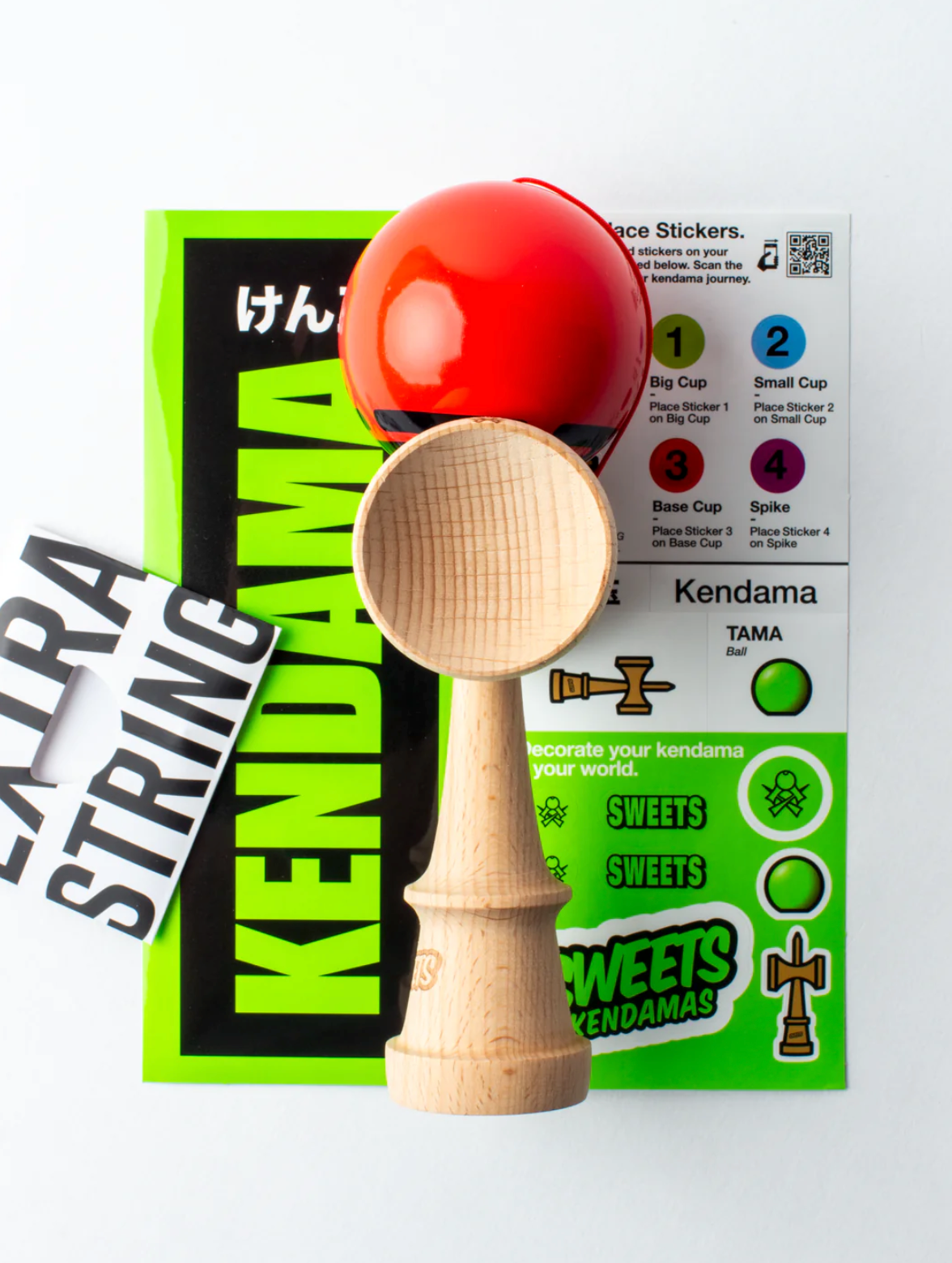 Kendama Prime Radar Red with bright red tama, wooden natural ken, stickers, and extra string for customization and grip.