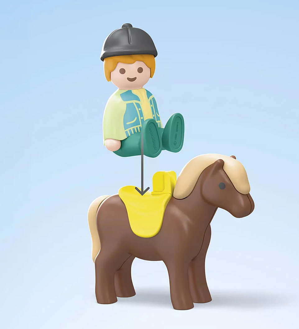 Junior | Farm Adventure with Tractor child figure riding a brown pony with yellow saddle against blue background