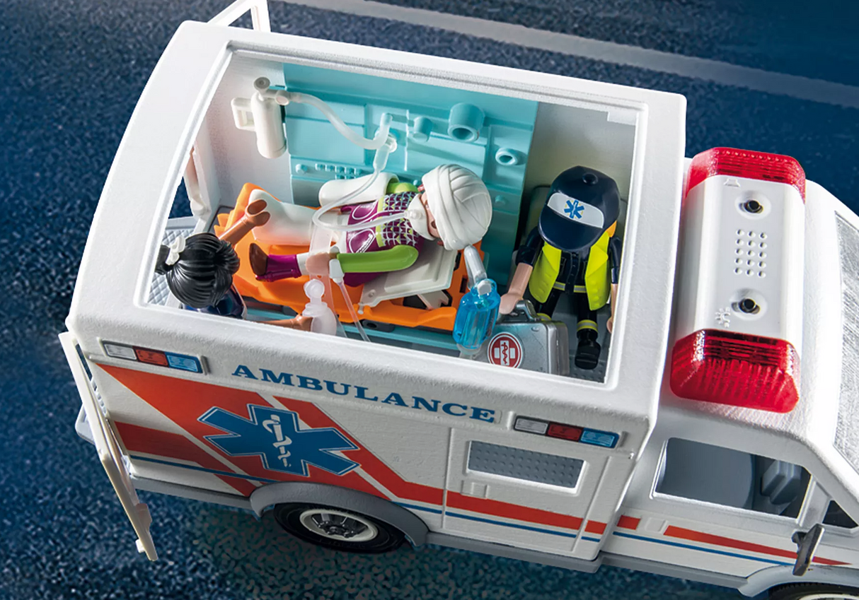 City Action | Ambulance with Lights toy showing interior with paramedics, patient on stretcher, and medical accessories.