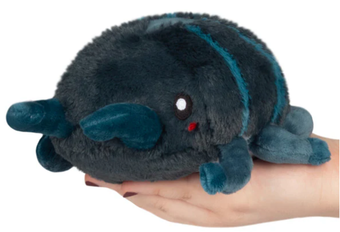 Soft plush Stag Beetle Snackers toy in dark blue held on a hand, perfect for cuddling and collecting.