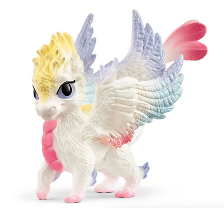 Bayala | Rainbow Baby Dragon with white coat, yellow crest, and pink, blue, turquoise shimmering wings, friendly for ages 5+