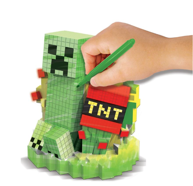 Hand decorating a pixelated vinyl Creeper figure with a green marker in Minecraft Design a Vinyl Kit.