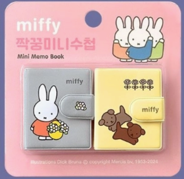Two small Miffy-themed memo books with colorful covers featuring Miffy and playful puppies on a pink backing card.