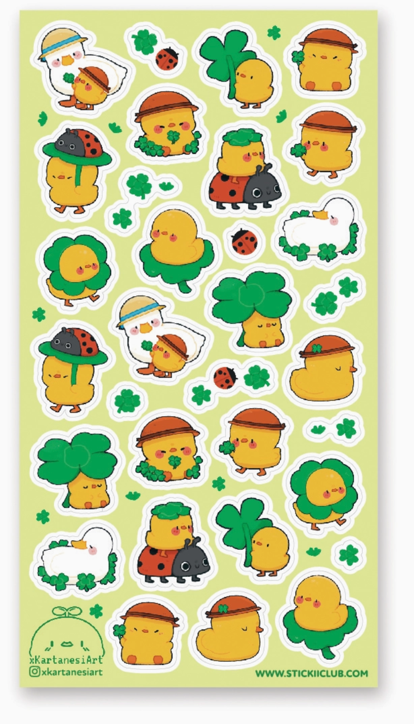 Sheet of Lucky Duckies stickers featuring cute yellow ducks with clovers, ladybugs, and playful hats on a light green background