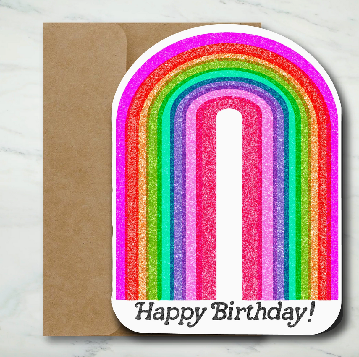 Folded birthday card with colorful textured rainbow and cheerful Happy Birthday text on white background