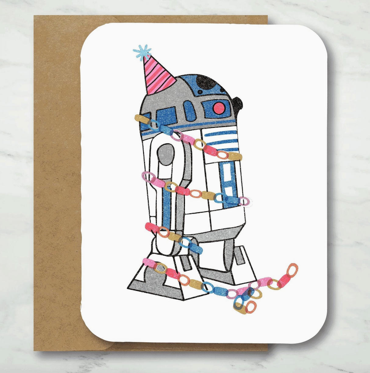 Birthday card featuring a robot wearing a party hat and colorful paper chain decorations on textured cardstock