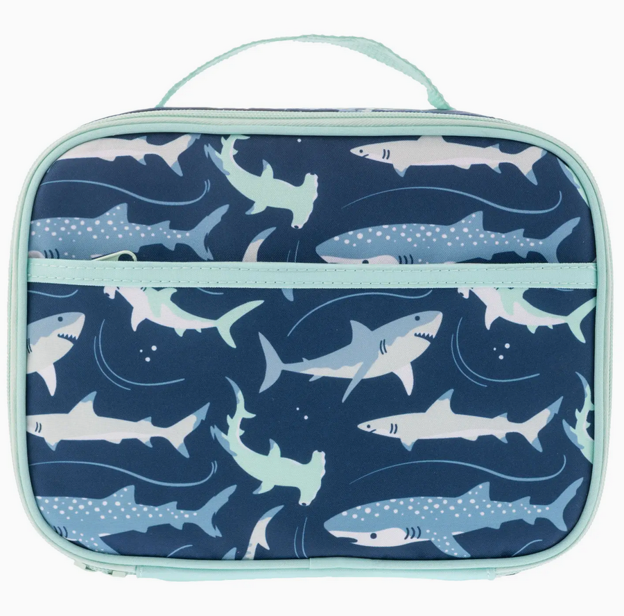 Junior lunchbox with fun shark pattern, insulated and waterproof with extra storage pockets and a light blue trim.