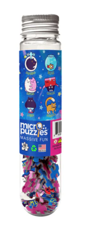 Clear tube of colorful micro puzzle pieces with cat-themed zodiac illustrations on the label and silver lid