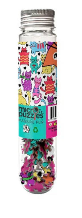Clear plastic tube with colorful cat designs on the label containing tiny puzzle pieces for a cats micro puzzle game.