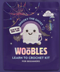 Packaging of The Woobles crochet kit featuring Snooky the Ghost with glow in the dark yarn and beginner-friendly instructions