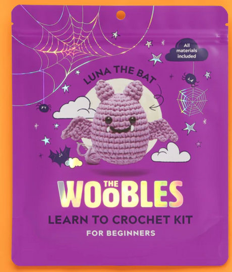 Purple packaging of The Woobles beginner crochet kit featuring Luna the Bat with friendly face and crocheted wings.