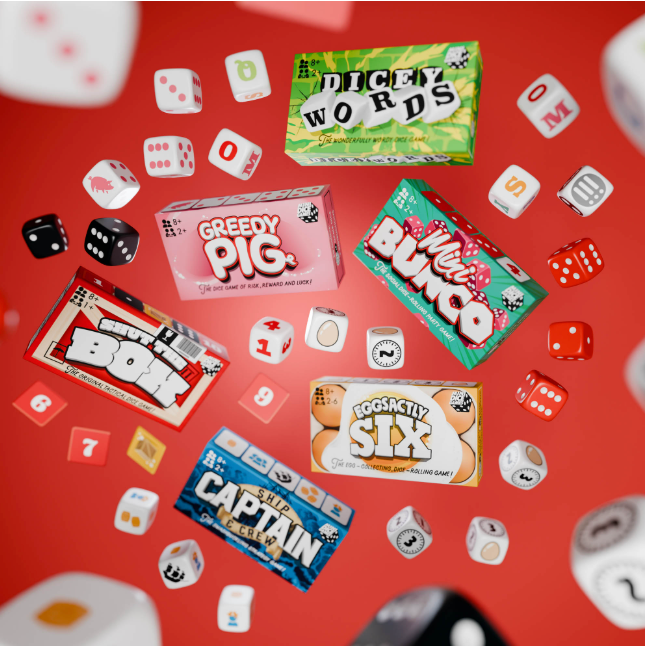 Mini Dice Game set with six colorful game boxes and various dice scattered on a red background for fun and travel play.