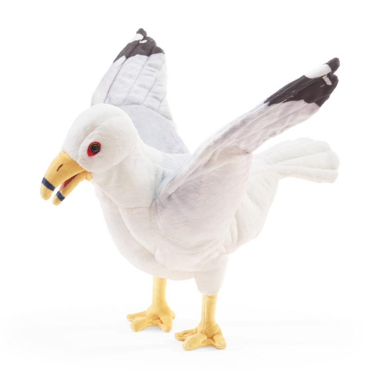 Soft plush seagull puppet with movable beak and wings standing with wings spread wide open