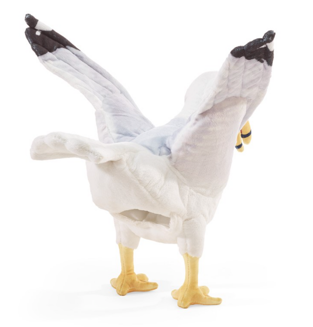 Soft and detailed gull puppet with movable beak and wings posed as if foraging for food on a white background
