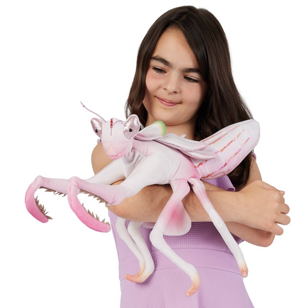 Girl holding a detailed pink and white Orchid Mantis puppet with long articulated legs and large eyes.