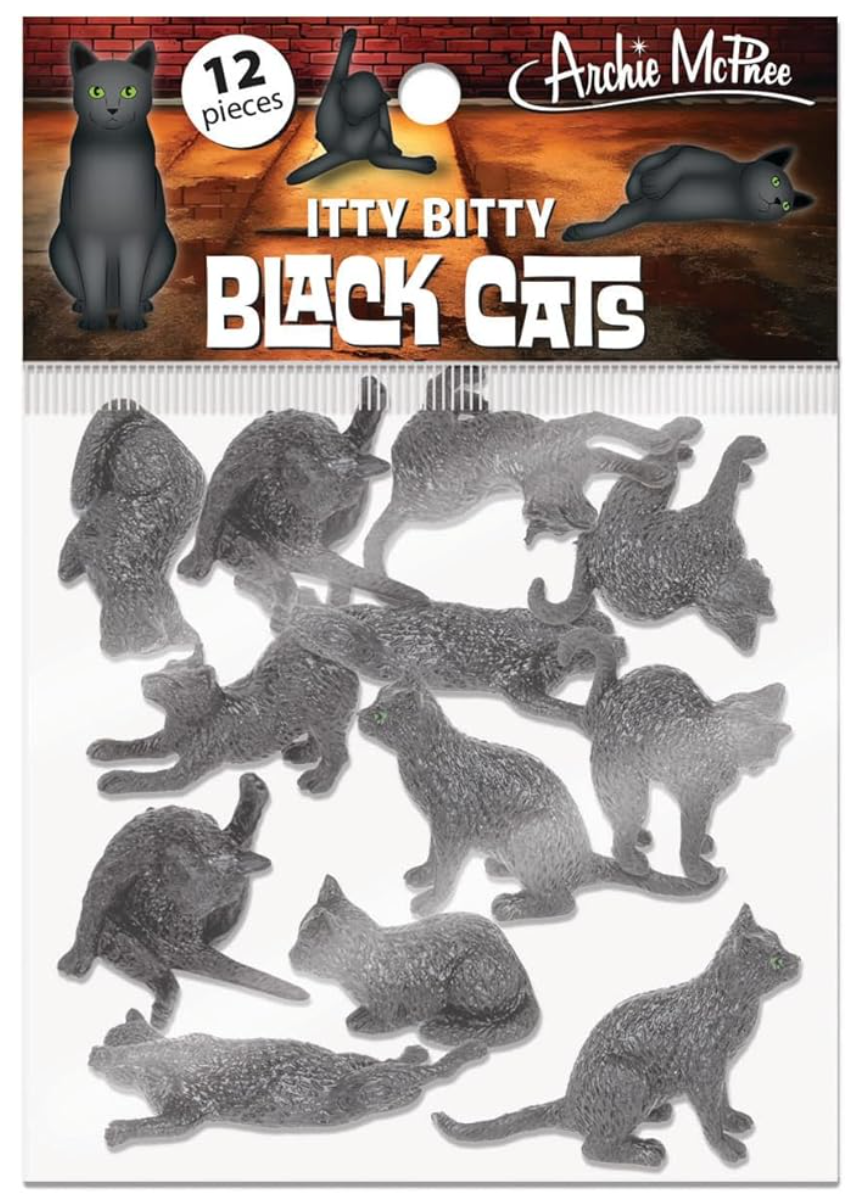 Bag of twelve small black cat figurines in various poses with green eyes on cardboard backing with product branding