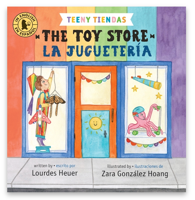 Colorful illustrated cover of a bilingual children’s book showing a toy store with playful toys in the windows.