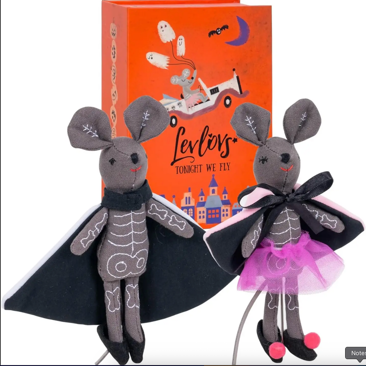 Two Halloween mice dolls wearing skeleton suits and capes with a festive orange box background