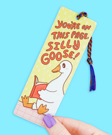Colorful bookmark with a cartoon goose holding a book and a rainbow tassel, reading "You're on this page, silly goose