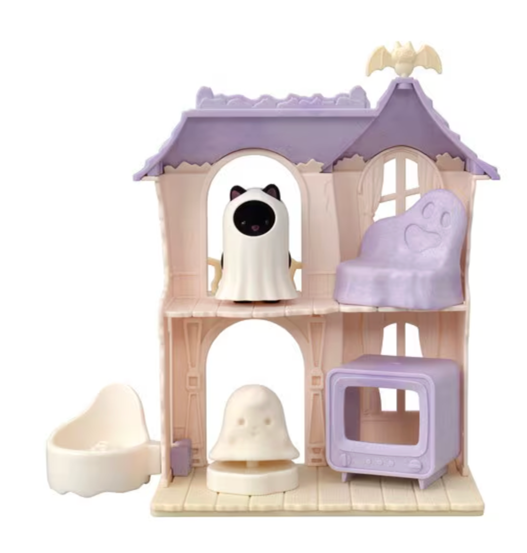Two-story spooky playhouse with ghost costume figure, ghost swivel pedestal, purple TV, sofa, and bat antenna on roof
