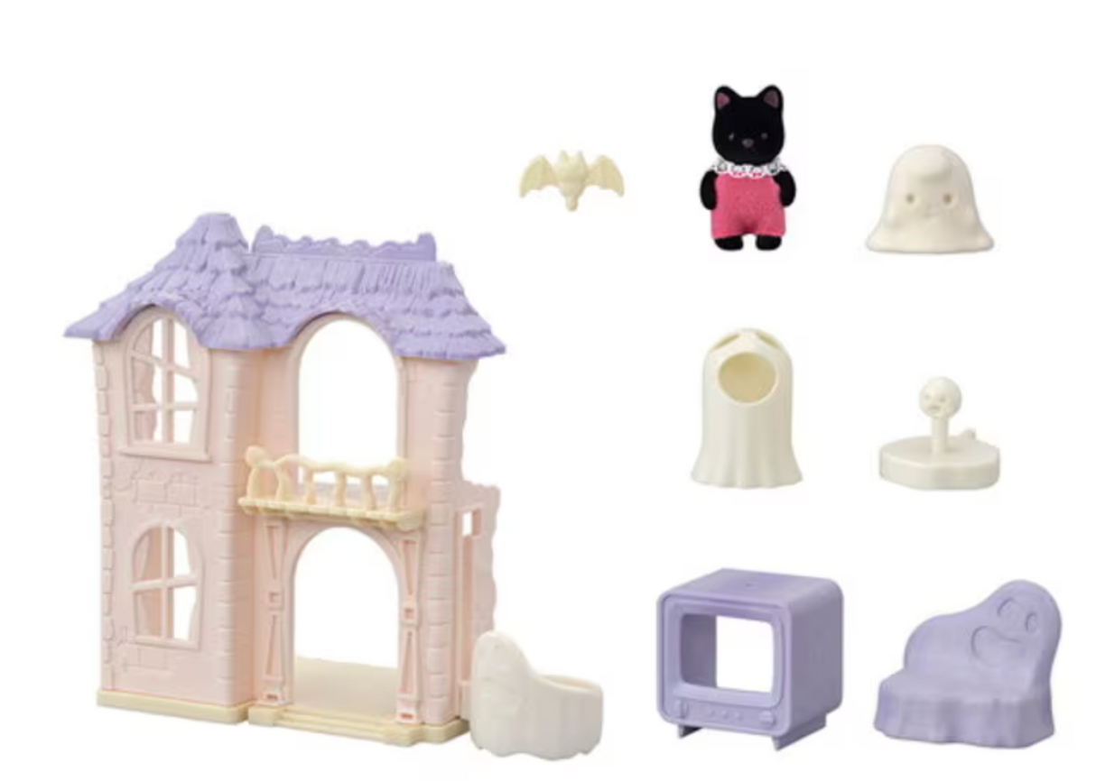 Spooky Surprise House playset with pastel purple roof, spooky figures, ghost costume, furniture, and accessories for imaginative play.