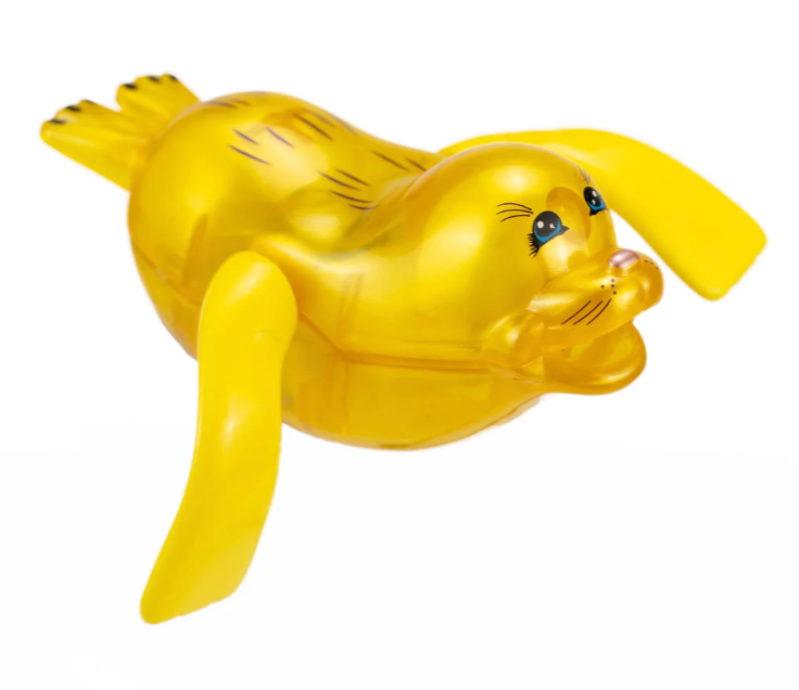 Yellow wind-up seal toy with smiling face and flippers designed for bath or pool play for children aged 3 and up