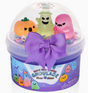 Clear purple slime with three spooky collectible charms and a large purple bow on the container lid.